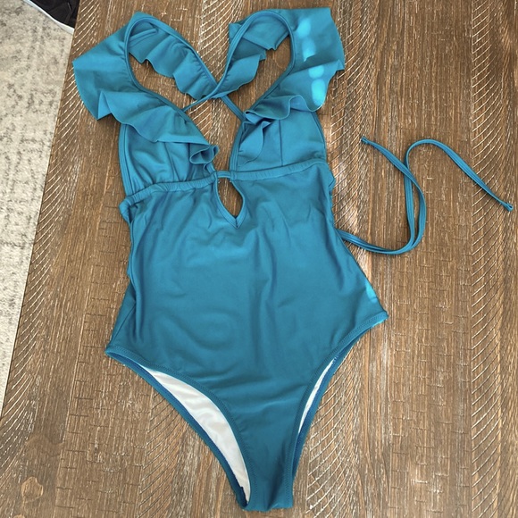 Teal strappy one piece swimsuit. - Picture 1 of 3
